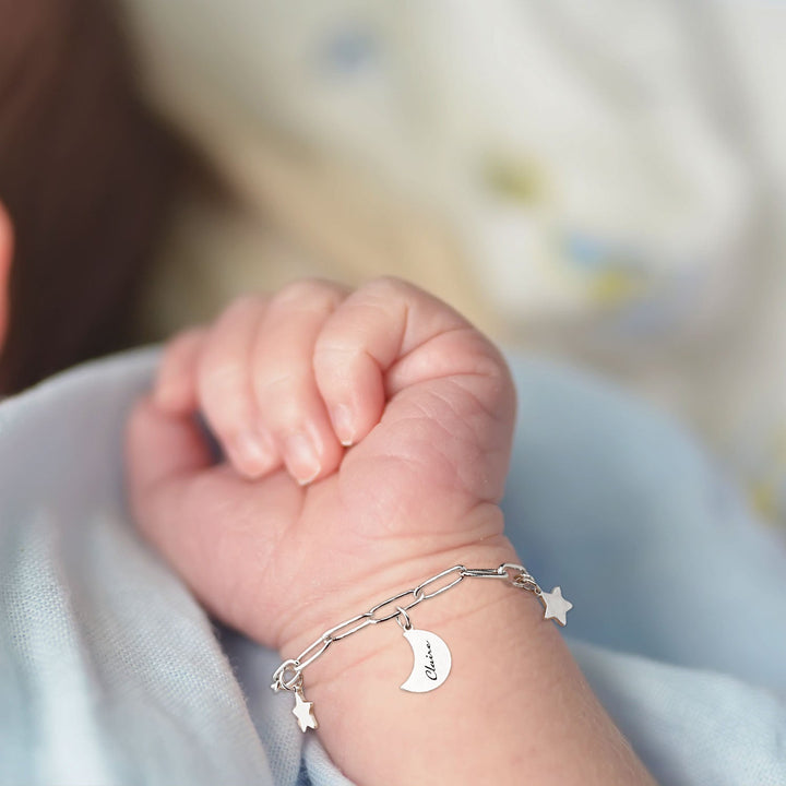 Silver Star and Moon Custom Baby Name Bracelet Worn on the baby's hand